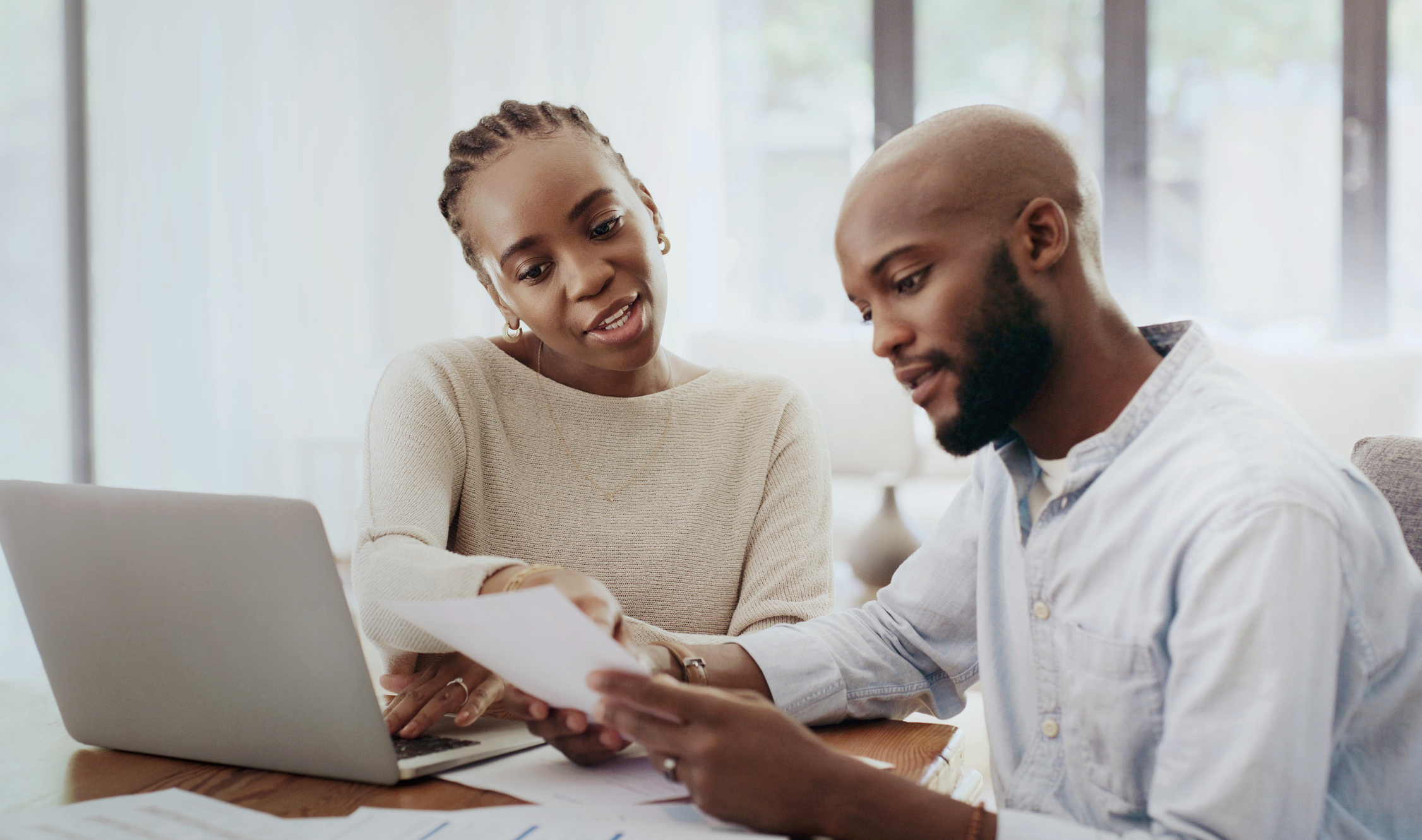 Couple using laptop
